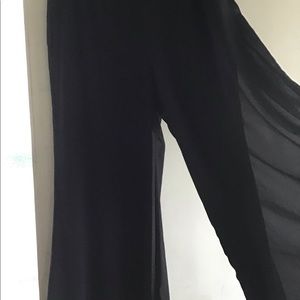 Black formal party pants with overlay of tule material.